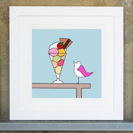 Giclee original artwork print in a white mounted frame. Square framed print of a pink winged seagull looking at an icream sundae with strawberry, flake, wafer and cream in a tall glass. The background is blue with a table outline holding the bird and desert.