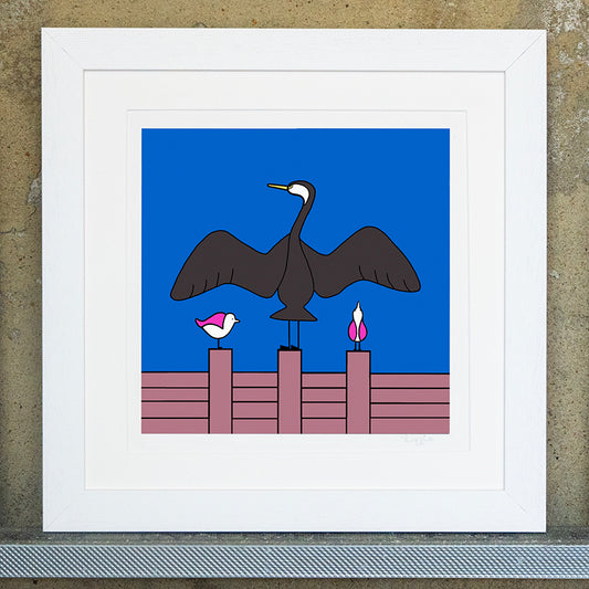 Giclee original artwork print in a white mounted frame. A groyne has a cormorant with it's wings spread out. Either side are two pink winged seagulls also perched on the groyne, one is looking up at the wing of the cormorant and the other to the side. the sky is bright blue.