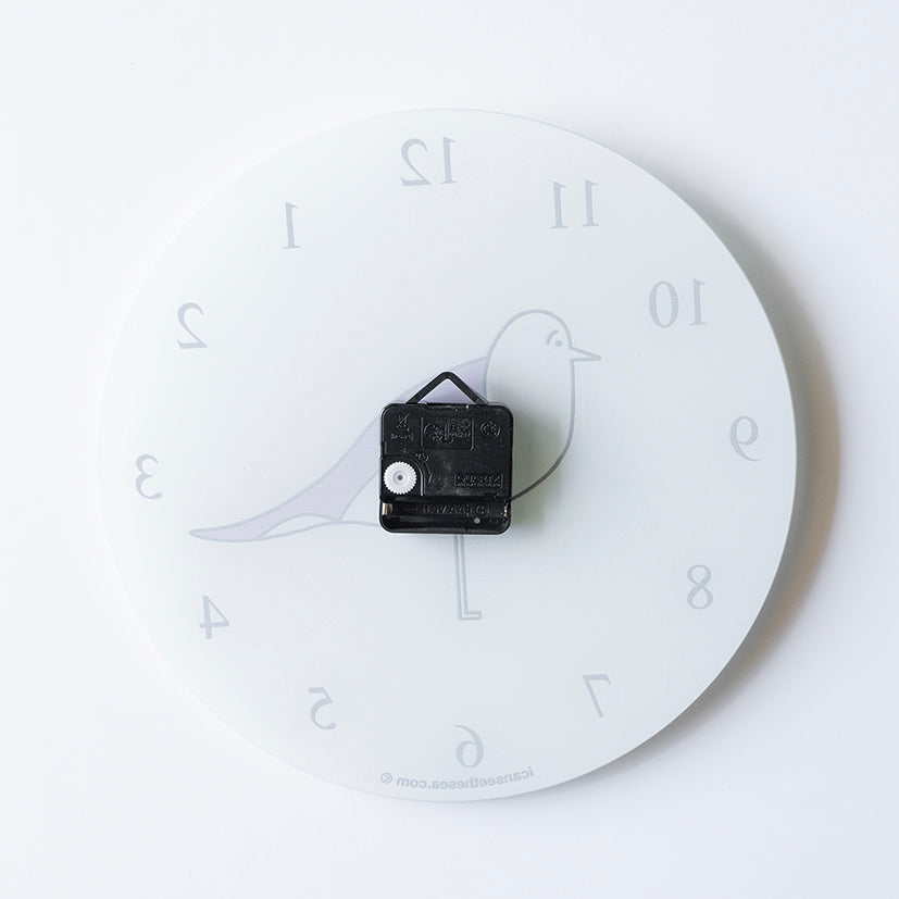 Back of a recycled glass clock with a black battery pack