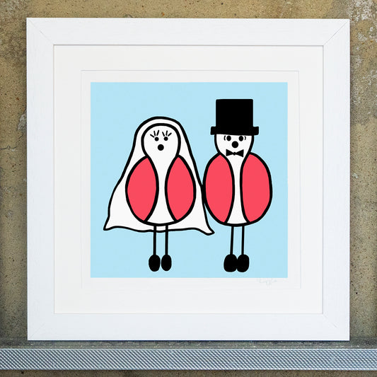 Giclee original artwork print in a white mounted frame. Two pink winged birds are dressed as bride and groom, the bride seagull has large eyelashes with a veil and the groom seagull has a bow tie and top hat. The two birds stand side by side, the background is a pale blue colour. The print is signed in the bottom corner with lizzie in pencil.