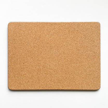 Back of the placemat made of eucaplyptus board with cork, the back is textured and a beige brown colour.