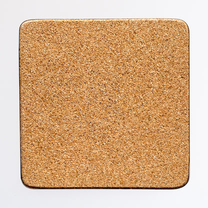 Back of the coaster made of eucaplyptus board with cork, the back is textured and a beige brown colour.