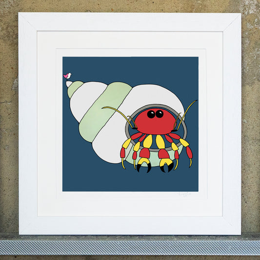 Giclee original artwork print in a white mounted frame. A glossy eyed hermit crab that is red and yellow with black tipped pincers is peaking out of a shell. The shell is a striped pale green and light grey. The background is a teal navy colour. A pink winged seagull is perched on the tip of the shell looking out.
