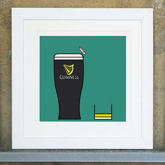 Giclee original artwork print in a white mounted frame. A pint of guiness and a small glass of whiskey are placed next to each other. The background is a bottle green colour. A small pink winged seagull is perched on the edge of the pint of guinness looking down at the whiskey.