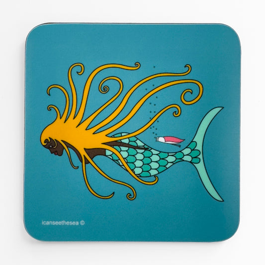 A teal green blue coaster of a painting of a mermaid. A mermaid is swimming across with golden hair sprawled out in different directions and some of the ends are curled into spirals. Alongside the mermaids tail is a pink winged seagull swimming with goggled and bubbles coming out and above.