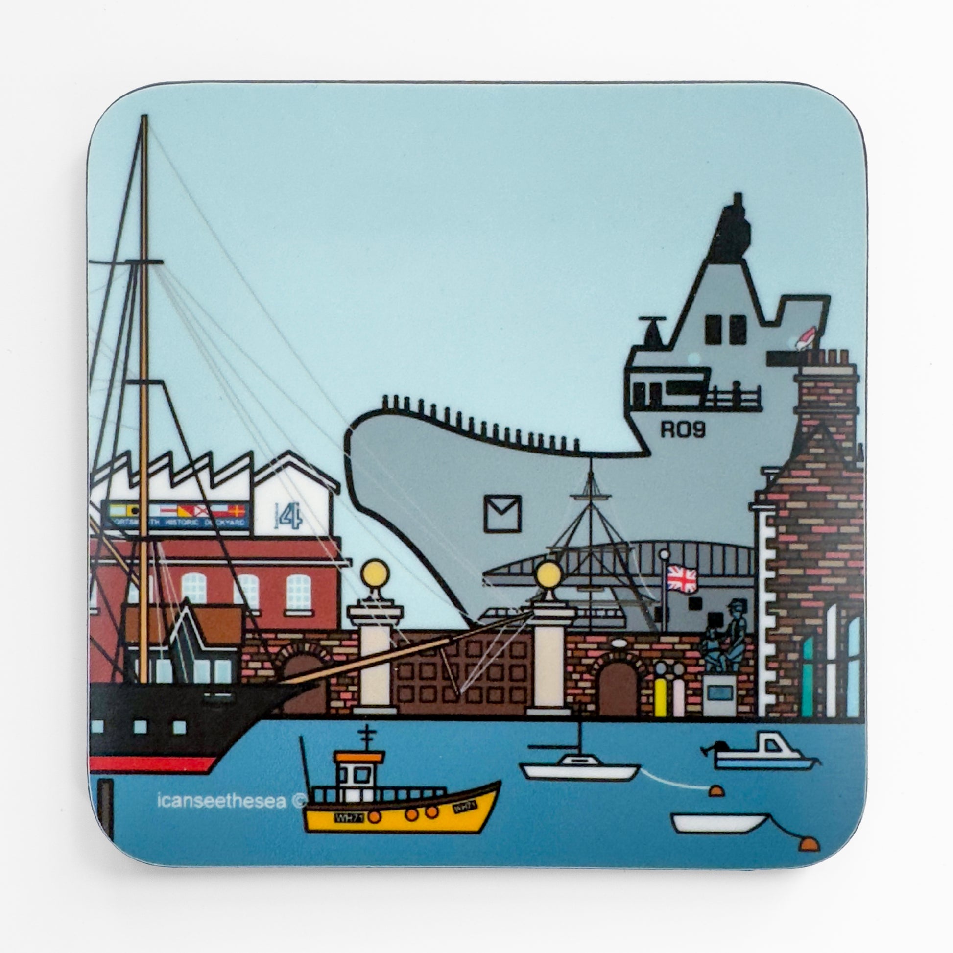 A blue coaster of a painting of Portsmouth Dockyard and the prince of wales carrier. The sea is bright blue with the warrior, small fishing boats and buoys. On the horizon is the main dockyard gate, wall, boathouse 4, porters lodge and sculpture. On top of one of the buildings sits a pink winged seagull on the chimney looking down. In the far distance is the prince of wales carrier in grey. The sky is pale blue.