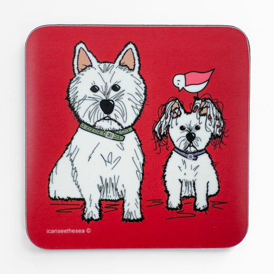 A bright red coaster of a painting of two white dogs. The dogs are facing forward one is a yorkie and the other a yorkshire terrier. One is smaller with floppy ears and wears a purple collar the other a green collar with small dog bones. Both dogs have black eyes and nose with black lines to create the texture of their fur. On top of the smaller dogs ear a pink winged seagull is perched looking down.